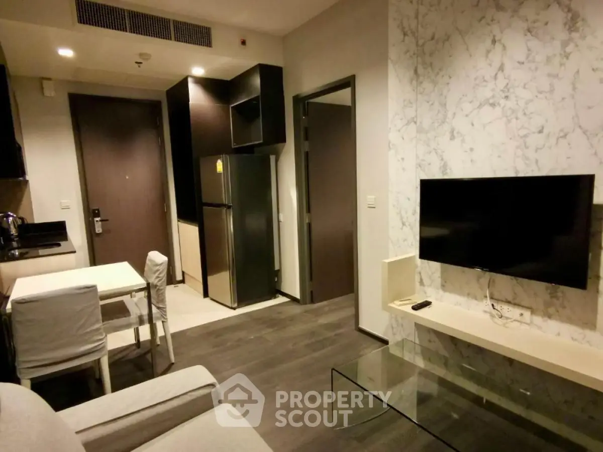 Modern apartment interior with sleek kitchen and cozy living area