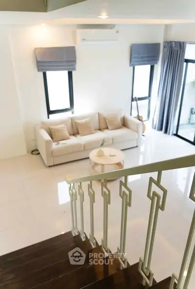 Elegant living room with modern decor and natural light