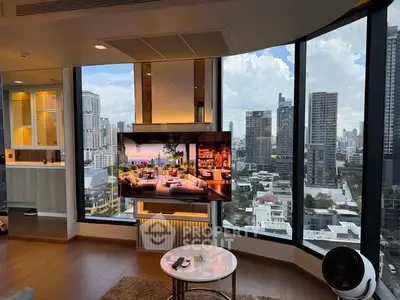 Luxurious living room with stunning city view and modern interior design.