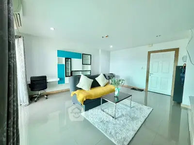 Spacious modern living room with sleek furniture and bright natural lighting