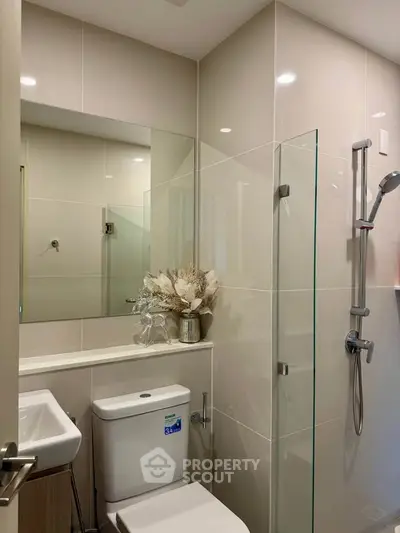 Modern bathroom with sleek design and glass shower enclosure