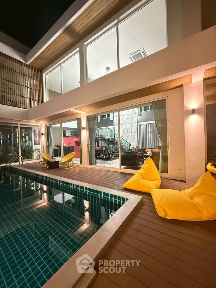 Luxurious modern villa with private pool and stylish outdoor seating area, perfect for relaxation and entertainment.