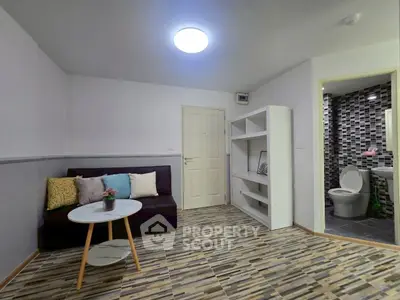 Modern living room with stylish flooring and cozy seating area