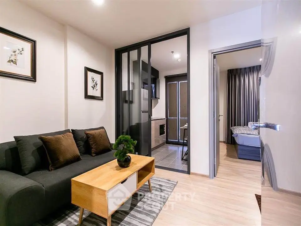 Modern living room with stylish decor and open kitchen layout