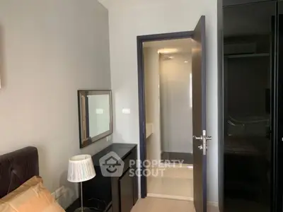 Modern bedroom with ensuite bathroom and sleek furniture design