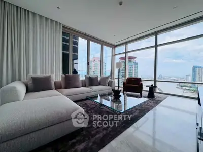 Luxurious living room with panoramic city views and elegant modern furnishings.