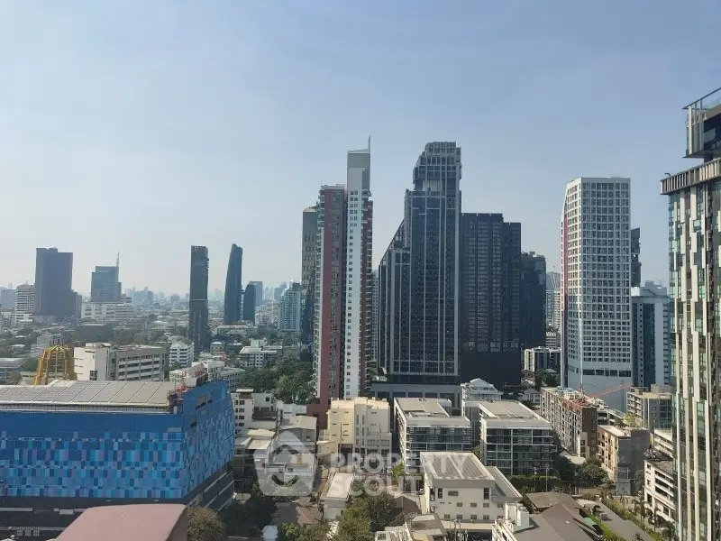 Stunning cityscape view showcasing modern high-rise buildings under a clear blue sky.