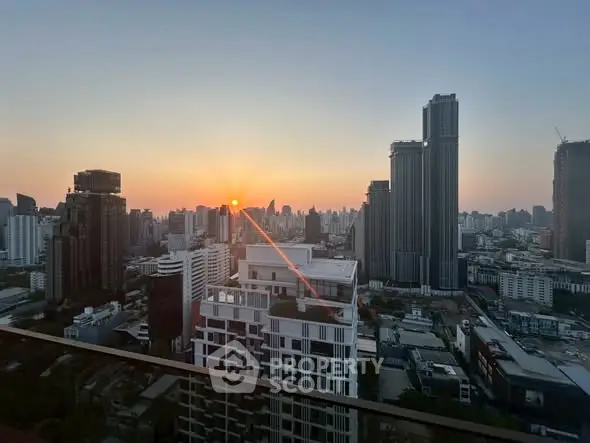Stunning city skyline view at sunset from a high-rise balcony