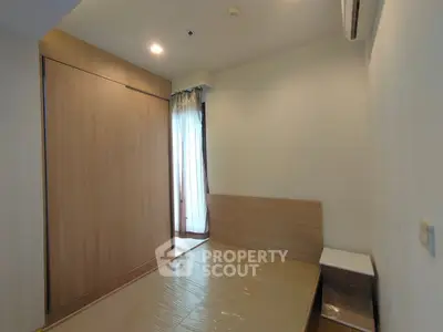 Cozy minimalist bedroom with wooden accents and natural light
