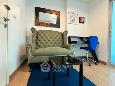 Charming study room with elegant armchair and modern desk in cozy apartment.