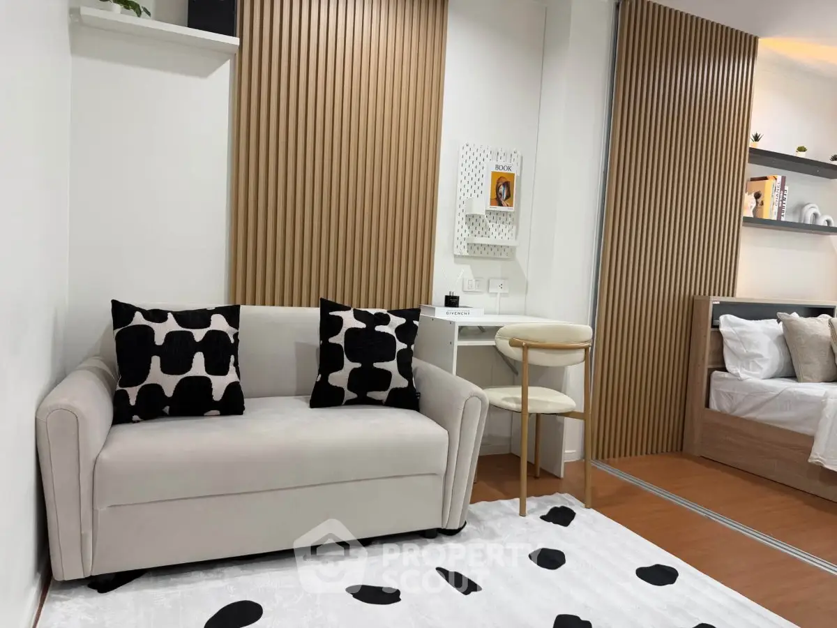 Modern living room with stylish decor and cozy seating area in a contemporary apartment.