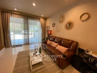 Cozy living room with leather sofa and stylish decor