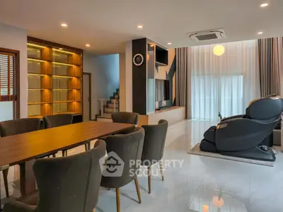 Luxurious living room with massage chair and elegant dining area
