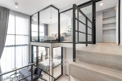 Modern duplex apartment with glass walls and stylish interior design