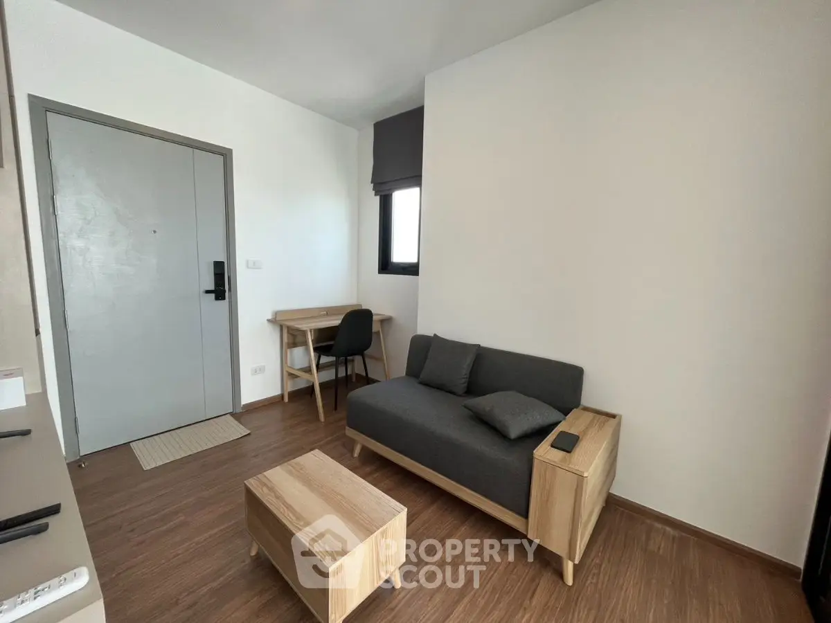 Modern living room with minimalist furniture and wooden flooring