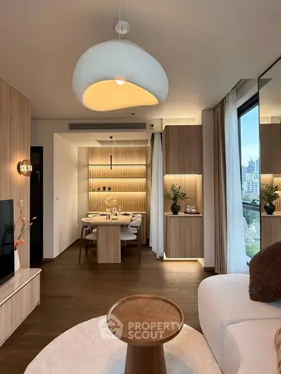 Modern living room with elegant dining area and city view