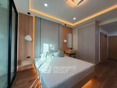 Modern bedroom with sleek design, ambient lighting, and wooden accents for a cozy and stylish living space.