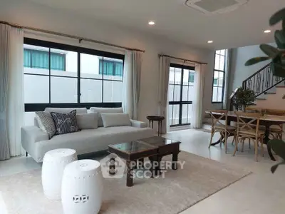 Spacious modern living room with elegant furniture and large windows