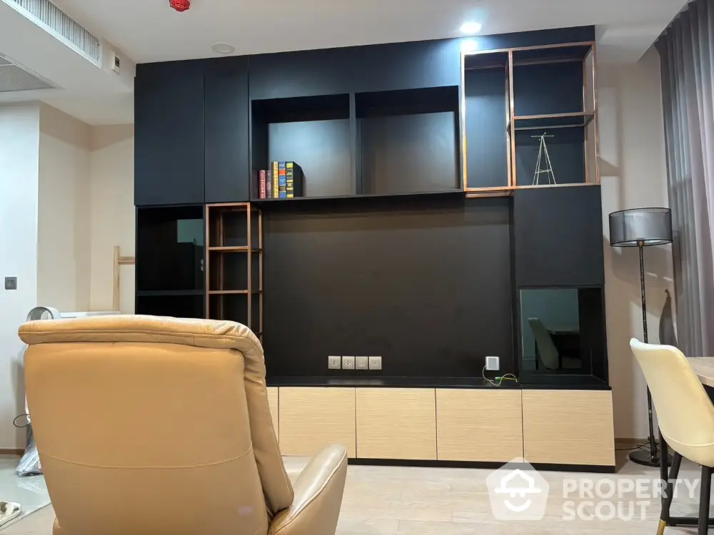 Modern living room with sleek built-in shelving and cozy seating area