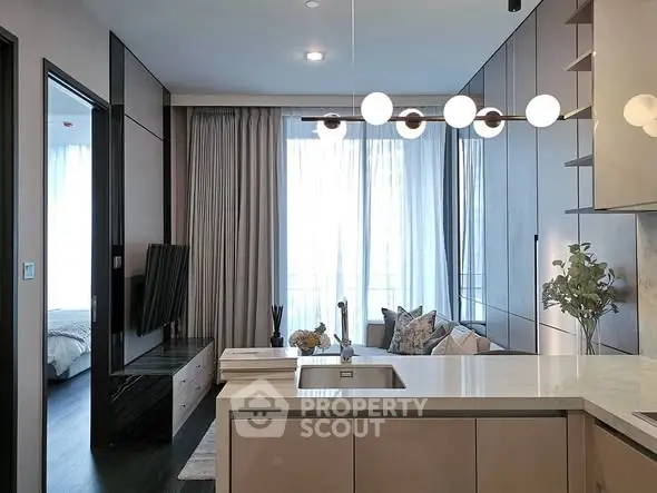 Modern open-layout kitchen with sleek design and cozy living area