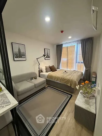 Cozy studio apartment with modern decor and natural light