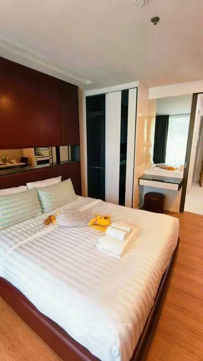 Modern bedroom with stylish decor and cozy ambiance, featuring a comfortable bed and sleek furnishings.
