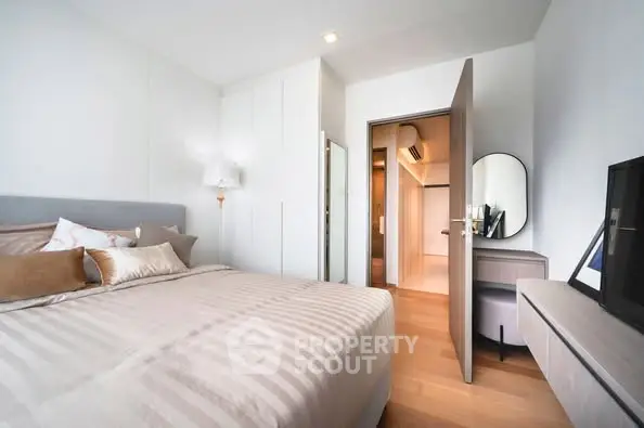Modern bedroom with stylish decor and ample natural light