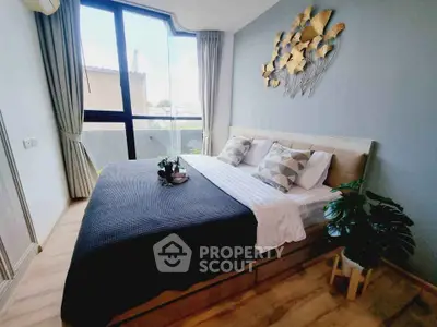 Modern bedroom with large window and stylish decor