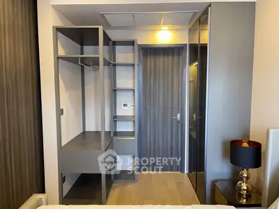 Modern bedroom with sleek built-in closet and stylish decor