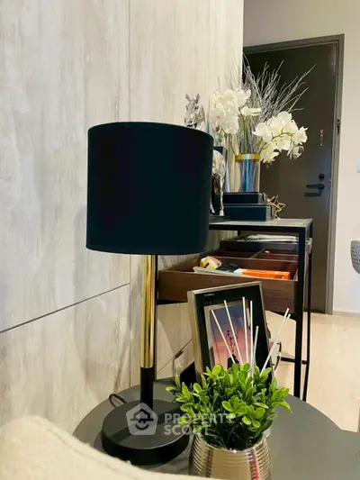 Stylish interior with modern lamp and elegant decor accents in a cozy living space.