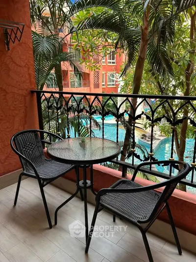 Charming balcony with pool view, perfect for relaxation and leisure.