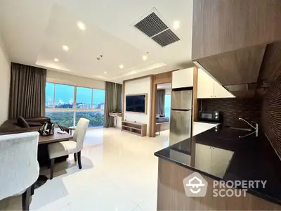 Modern open-layout living room with kitchen and city view