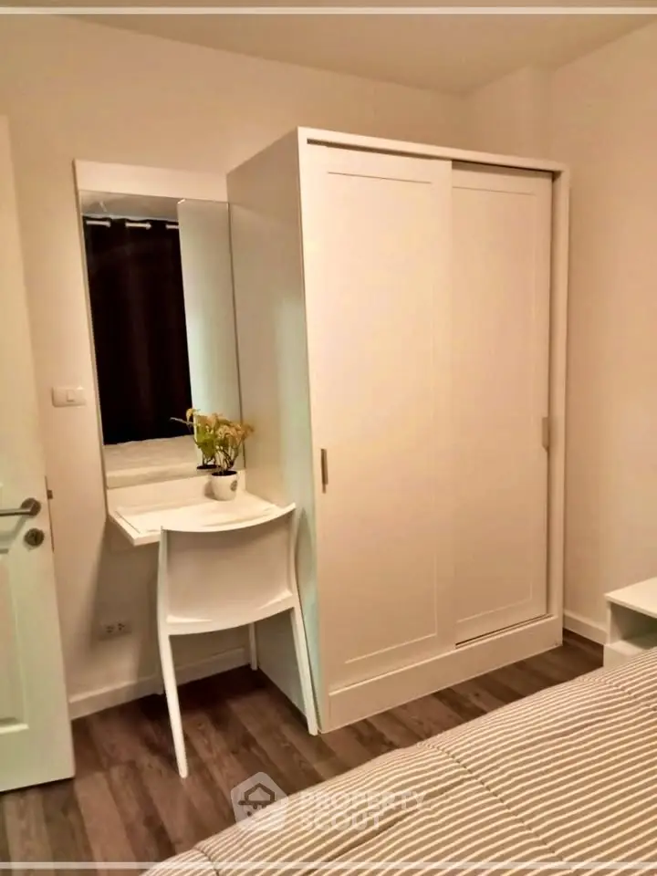 Cozy bedroom with modern wardrobe and stylish decor