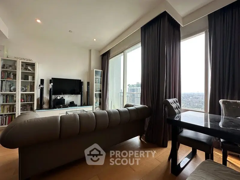 Luxurious living room with panoramic city view, elegant furniture, and floor-to-ceiling windows.