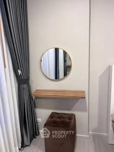 Modern bedroom corner with stylish mirror and elegant curtains