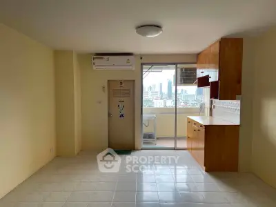 Spacious apartment with city view and open layout kitchen, perfect for modern living.
