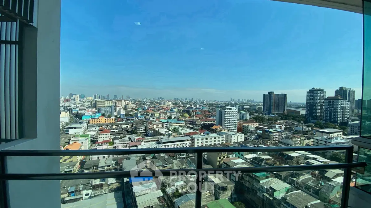 Stunning cityscape view from high-rise balcony showcasing urban skyline.