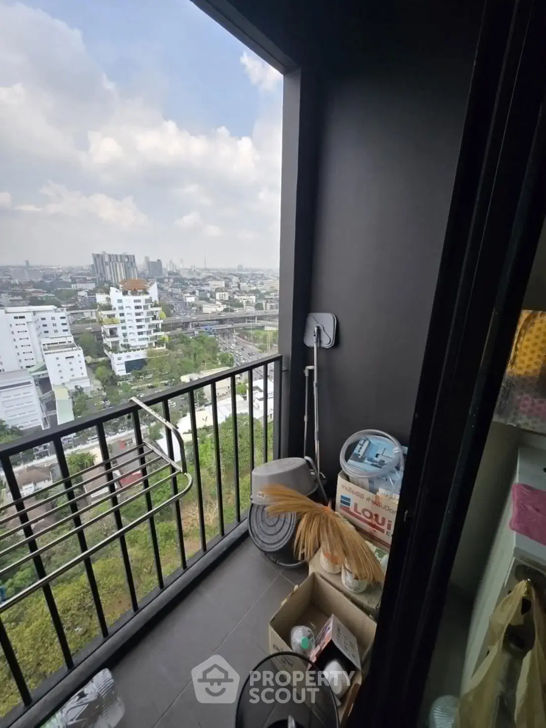 Cozy balcony with city view, perfect for relaxation and enjoying urban scenery.
