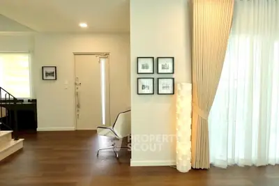 Elegant living room with modern decor and natural light