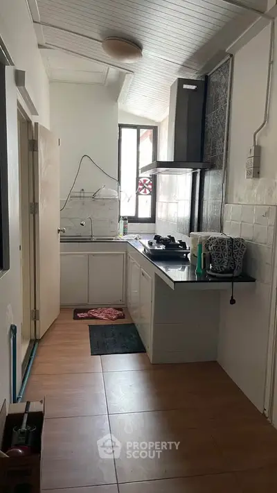 Cozy kitchen with gas stove and modern design in compact layout