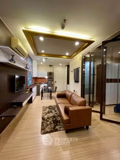 Modern living room with stylish decor and open kitchen layout