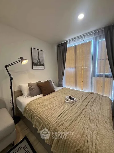 Cozy bedroom with modern decor and natural light