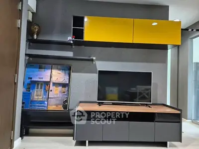 Modern living room with sleek TV unit and vibrant yellow cabinets