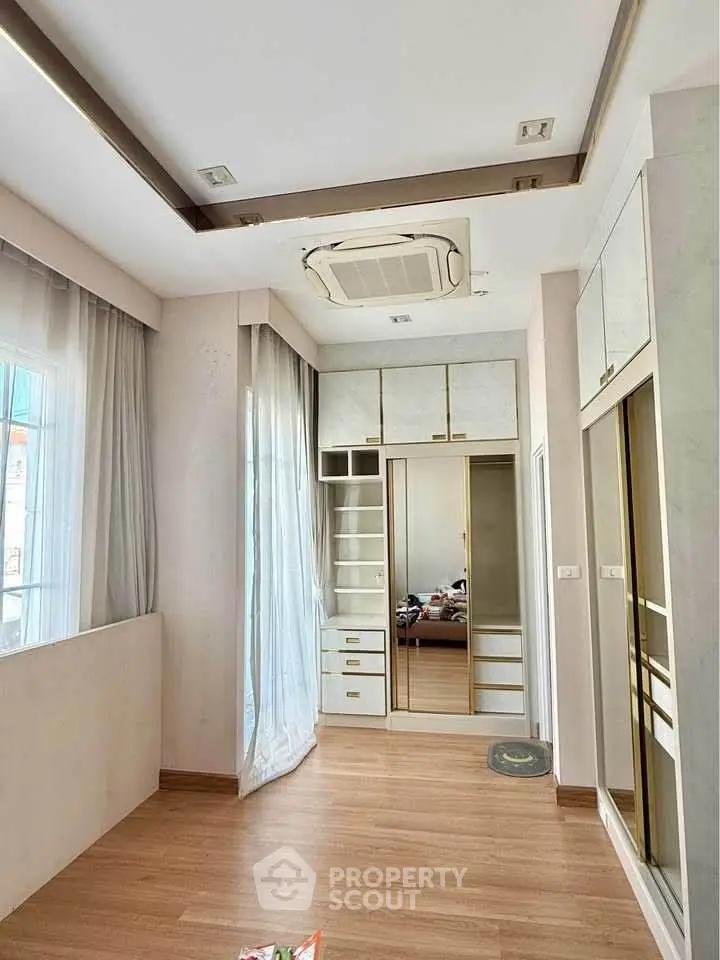 Spacious bedroom with modern design and ample natural light