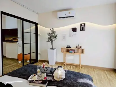 Stylish bedroom with modern decor and air conditioning, featuring a cozy ambiance.