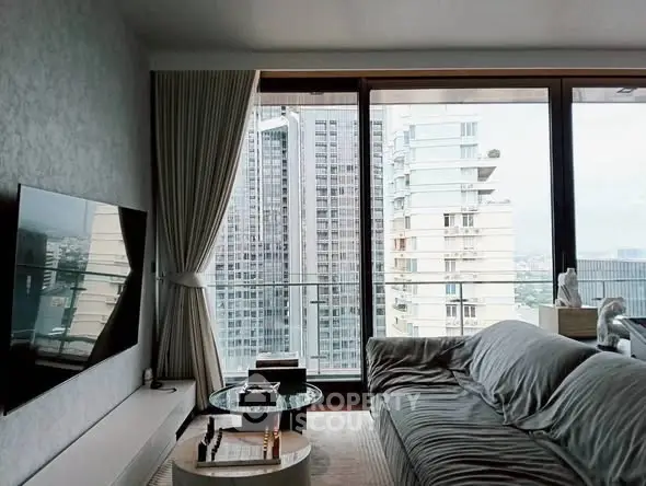 Luxurious living room with floor-to-ceiling windows and stunning city view