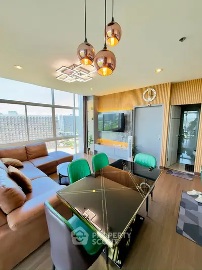 Modern living room with stylish decor and city view, featuring a sleek dining area and comfortable seating.