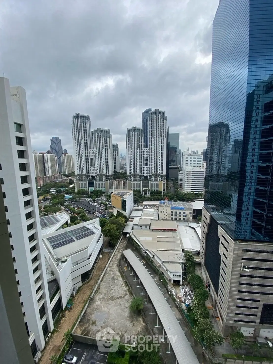 Stunning cityscape view from high-rise building showcasing urban skyline and modern architecture.