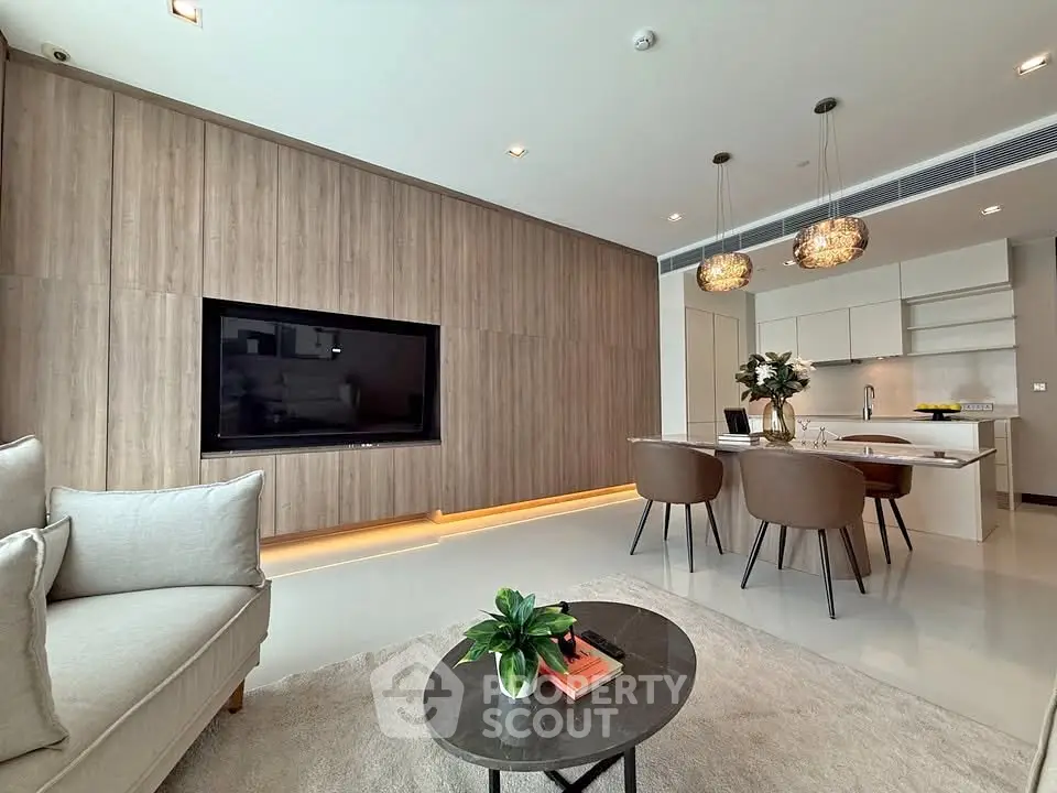 Modern open-layout living room with stylish kitchen and elegant decor