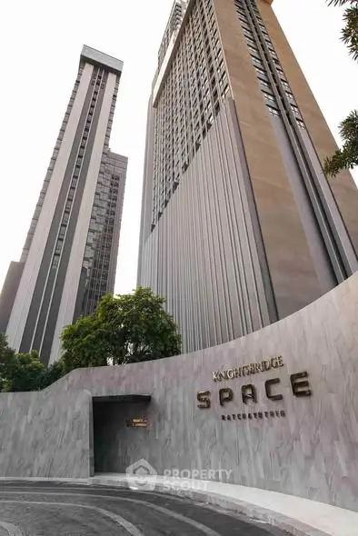 Stunning modern high-rise building exterior with sleek architectural design in prime urban location.